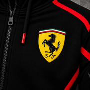 REVLINE Ferrari hoodie yellow prancing horse shield left-chest close-up, black fabric and red piping