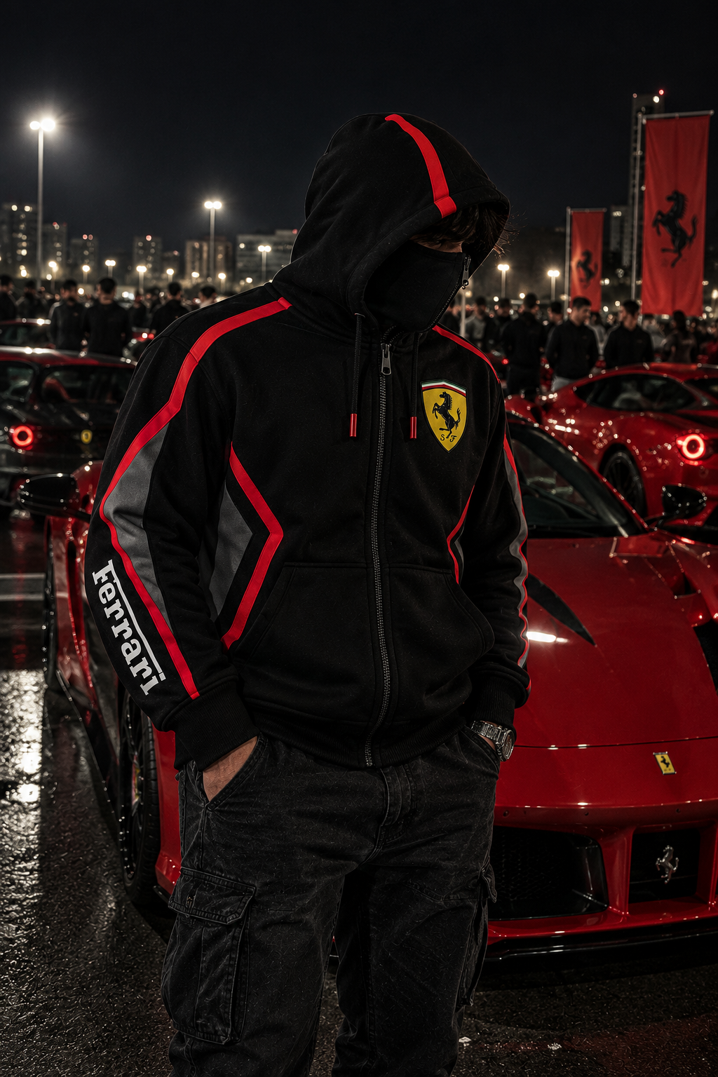 REVLINE Ferrari hoodie male lifestyle at nighttime Ferrari car meet, black red single-zip balaclava hoodie with Ferrari shield and right sleeve lettering