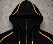 REVLINE Lamborghini hoodie integrated zip-up balaclava hood close-up, black with gold piping, no hood logo, grey concrete background