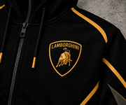 REVLINE Lamborghini hoodie gold shield bull emblem close-up on left chest, black fabric with gold piping
