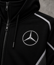 Mercedes AMG hoodie left chest silver Mercedes star logo close-up on black fabric
